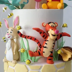 Tigger and Rabbit join the party! Each character is carefully placed to create a sense of fun and movement on the cake.