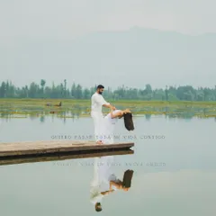 A serene and romantic pre-wedding moment captured on a wooden dock at Dal Lake, Kashmir. We travel with our couples to create beautiful narratives in stunning locations before their big day.