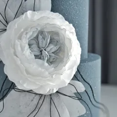 A detailed shot of the wafer paper flower, showing the delicate, layered petals.