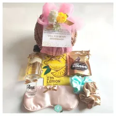 A wedding isn't a wedding without your bridesmaids. This hamper is the perfect way to ask "Will you be my Bridesmaid?" with a personalized shot glass, face mask, and other treats.
