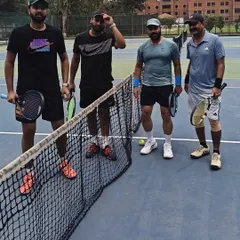 A group of our Masters players ready for a doubles match. Our community brings together players of all levels who share a love for the game.
