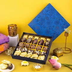 A vibrant, high-contrast shot of a Diwali sweet box, using a bold yellow and blue palette to grab attention on social media feeds.