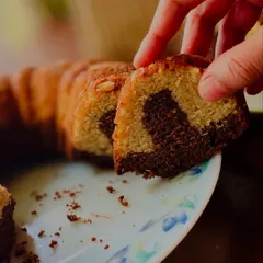 A close-up of a slice of the marble cake, showing the perfect swirl of vanilla and chocolate.