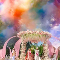 For a modern fairytale wedding, I designed this pastel floral mandap. The look was completed with a dramatic color smoke effect during the varmala, creating a picture perfect moment against the open sky.