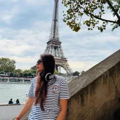 A candid moment in Paris, with my headphones always close by. Music is a constant companion, whether I'm on stage or exploring a new city.