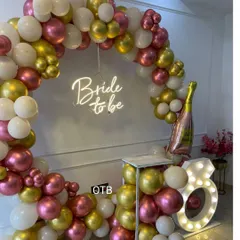 Another perspective of the popular bridal shower setup, showing the champagne bottle foil balloon which adds a fun, celebratory touch.