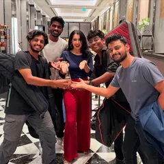 The band celebrating together after a gig. We travel across India for shows, from Pune and Hyderabad to Udaipur and Chennai.
