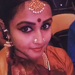 A close-up of the traditional makeup and costume for a Bharatanatyam competition. The details are just as important as the dance itself to create an authentic experience.
