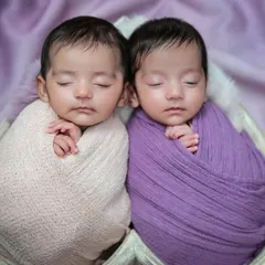 Double the love with this sweet twin newborn session. I have experience in safely and beautifully posing twins together, capturing their special bond from the very beginning in coordinated setups like this heart-shaped basket.