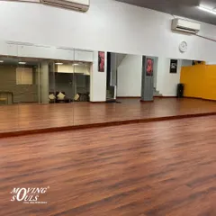 The full expanse of our wooden dance floor and mirrored wall, providing the perfect environment for learning and practice.