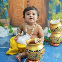 A happy little Krishna with his pot of butter. The genuine smiles and giggles are what make these sessions so special and the memories so dear.