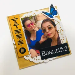 A close-up of my handmade mini acrylic frame, featuring a Spotify code and a "Beautiful" sticker. It's a modern and stylish way to display a photo.