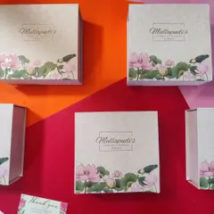 Personalized wedding favors are one of our specialties. These custom-designed boxes feature a beautiful lotus motif and the couple's logo, creating a thoughtful and elegant giveaway for guests to remember the special day.