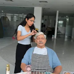 Behind the scenes at a shoot for Medanta Hospital. I'm providing age-appropriate makeup for an older male actor, ensuring he looks natural and authentic for the video campaign.