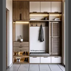This comprehensive entryway unit has it all: a seating bench with drawers underneath, open shoe shelves, coat hooks, and overhead cabinets for maximum storage in a compact footprint.