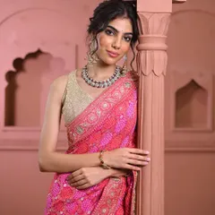 The joy of finding the perfect fit and style. This image captures the confidence that comes from wearing a piece that truly suits you, from the intricate saree to the complementary statement jewelry.