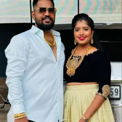 The client with her partner, her custom velvet top adding a touch of glamour to her look.