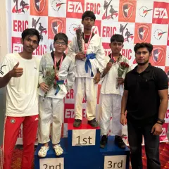The result of dedication and hard work. I am proud to stand with my students on the winners' podium as they celebrate their achievements at a Taekwondo competition.