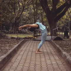 A standing backbend on an outdoor path. As the great B.K.S. Iyengar said, in backbends, the outer mind is silenced and the inner mind is made to work. They teach us to be "cautiously bold."