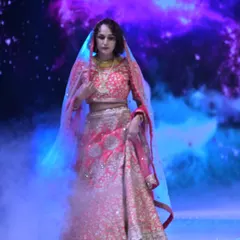 For the bride who loves drama and tradition, I created this opulent red lehenga. The rich embroidery and luxurious fabric are designed to make a powerful statement, blending classic Indian artistry with a modern, regal presence.