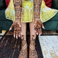 A complete bridal set for hands and feet. This design features classic Rajasthani elements, with symmetrical patterns and animal motifs that create a cohesive and royal look.