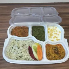 We deliver wholesome and delicious packed meal thalis, perfect for office lunches or events. This pure vegetarian meal includes jeera rice, dal, a vegetable preparation, raita, and salad, all neatly packed and ready to enjoy.