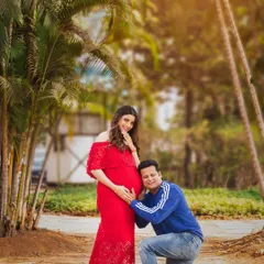 A playful and tender moment during an outdoor maternity shoot. Capturing the dad-to-be's excitement is just as important in telling the story of your growing family.