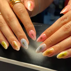 Aura nails are such a vibe, and this set is a total fav. I created a soft, multi-color gradient on each nail using dreamy pastels like pink, yellow, and blue, then topped them with delicate gold starbursts for that extra sparkle.