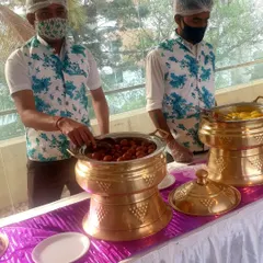 A closer view of Gulab Jamuns being served from an ornate brass pot. I use high-quality serving ware to maintain food temperature and enhance the presentation.