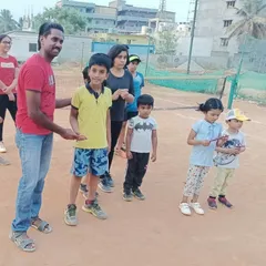 A candid moment with the group. Coaching kids of different ages together helps the younger ones learn by watching, and the older ones develop leadership skills.