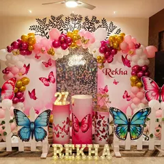 A beautiful butterfly theme for an adult's birthday, using a sophisticated palette of pink, magenta, and gold. A sequin wall adds a touch of glamour.