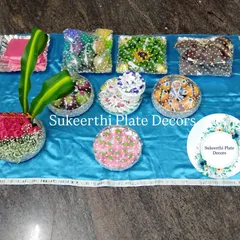 For this ear piercing ceremony in Coimbatore, I created a set of platters with a vibrant blue theme. The arrangement includes decorated sweets, dry fruits, and a floral centerpiece, all wrapped and ready for the function.