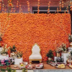 Nothing says celebration quite like a wall of fresh marigolds. This vibrant orange backdrop for a Haldi ceremony is one of my signature offerings, creating a joyful and picture-perfect spot for this happy occasion.
