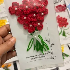 The same greeting card design, but with a classic red flower bouquet. The pearl details in the center of each flower add a touch of elegance.