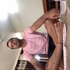 An online client practicing a seated leg cradle pose during one of my virtual sessions. I provide live instructions to ensure proper form and deep stretching, even from a distance.