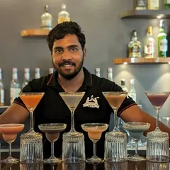 A member of our team with his impressive lineup of cocktails, showcasing the variety and quantity we can handle for any event.