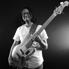 Holding down the low end is Mikhail on bass. His exhilarating basslines and solid grooves are the foundation of our rhythm section.