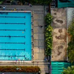 An aerial view of our swimming centre reveals the impressive scale and design of our pools. These shots showcase our clean, organized, and spacious environment, perfect for both training and leisure.