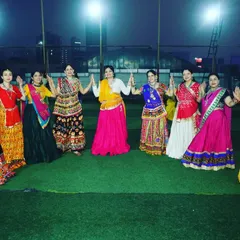 Our ladies' group dressed in colorful traditional attire for our Garba night. We choreograph specific routines for festive events that embrace the spirit of the occasion.