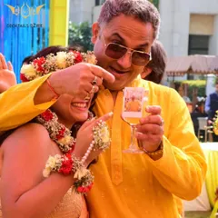 I love adding touches that tell your story. Here, we created a 'photo cocktail' by adding an instant picture of the happy couple to their drink, making for a fun surprise and a great photo opportunity at their Haldi ceremony.