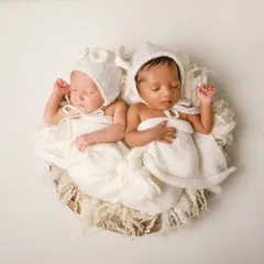 Double the love. Photographing newborn twins is a special joy, and I focus on posing them together to show the incredible bond they already share.