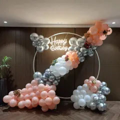 A wider view of the circular balloon arch, showing the full arrangement and how it creates a beautiful focal point in the room.