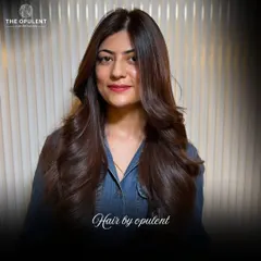 A final look at this happy client. Her hair looks healthy, shiny, and perfectly styled, showcasing the quality of the color and cut.