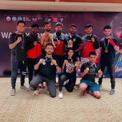Our fighters showcasing their hard-earned medals. We train athletes for various kickboxing categories, including Point Fight and Kick Light, leading to multiple wins.