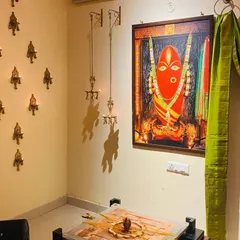 The corner of our studio where the Devi Avigna Yantra resides, adorned with offerings and illuminated by lamps. This is a space for seekers to connect with Devi's boundless, compassionate presence.