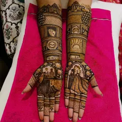 A complete love story on the arms. This custom mehendi features the couple's portraits, their wedding date, and special symbols that are meaningful to them.