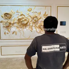 You feel the fire in you when you stand in front of what you created! This is me admiring a finished floral relief mural with beautiful gold accents on a marble-textured background.