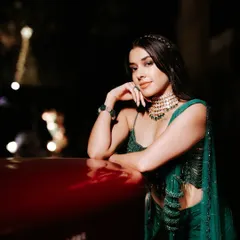 A stunning and dramatic evening shot. The bride's makeup is sultry and sophisticated, perfect for a glamorous cocktail party or reception.