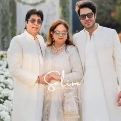 A family looking elegant in coordinated white and ivory outfits that I designed for a wedding event. Creating a cohesive look for a family is a service I truly enjoy.