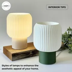 These modern, ribbed table lamps come in different colors to match any decor. Their simple yet elegant design makes them suitable for adding a touch of style and soft light to reception desks or retail display counters.